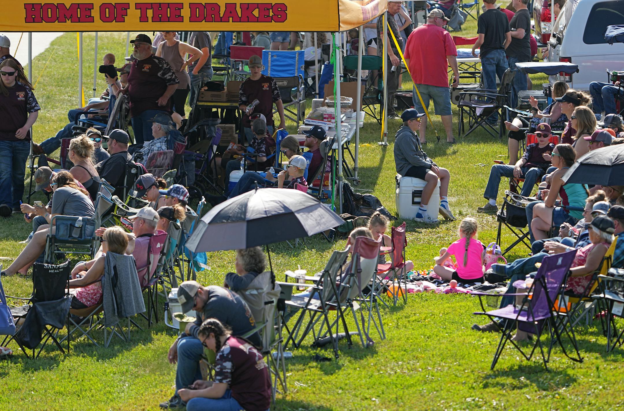 Fans and family set up camp near the range and watch their teams from the comfort of lawn chairs.