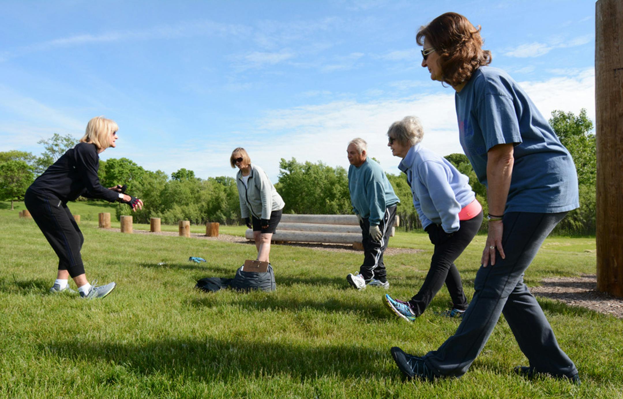 Fitness instructor Jill Greenan, of Burnsville, led students Pat Thielman, of Apple Valley, and Tom Blunt, Mary Simplot, and Audrey Winbigler, of Eagan, in a warmup.