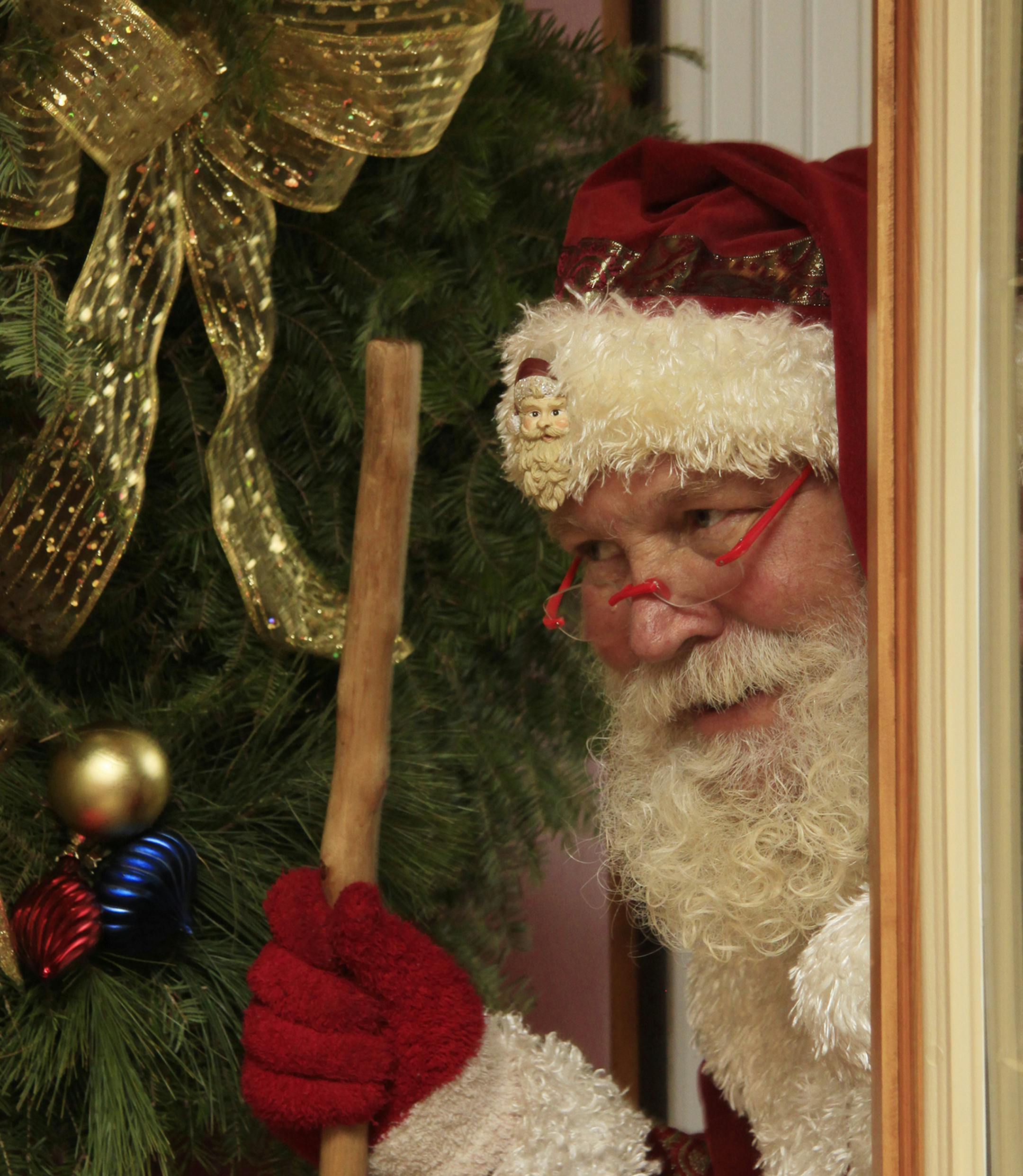This Photo was taken in St. Joseph, MN and features a local Santa who arrived at our annual family gathering and delighted believers young and old. He really put the "Merry" in our ChristmasII Sheila Langer, Medina