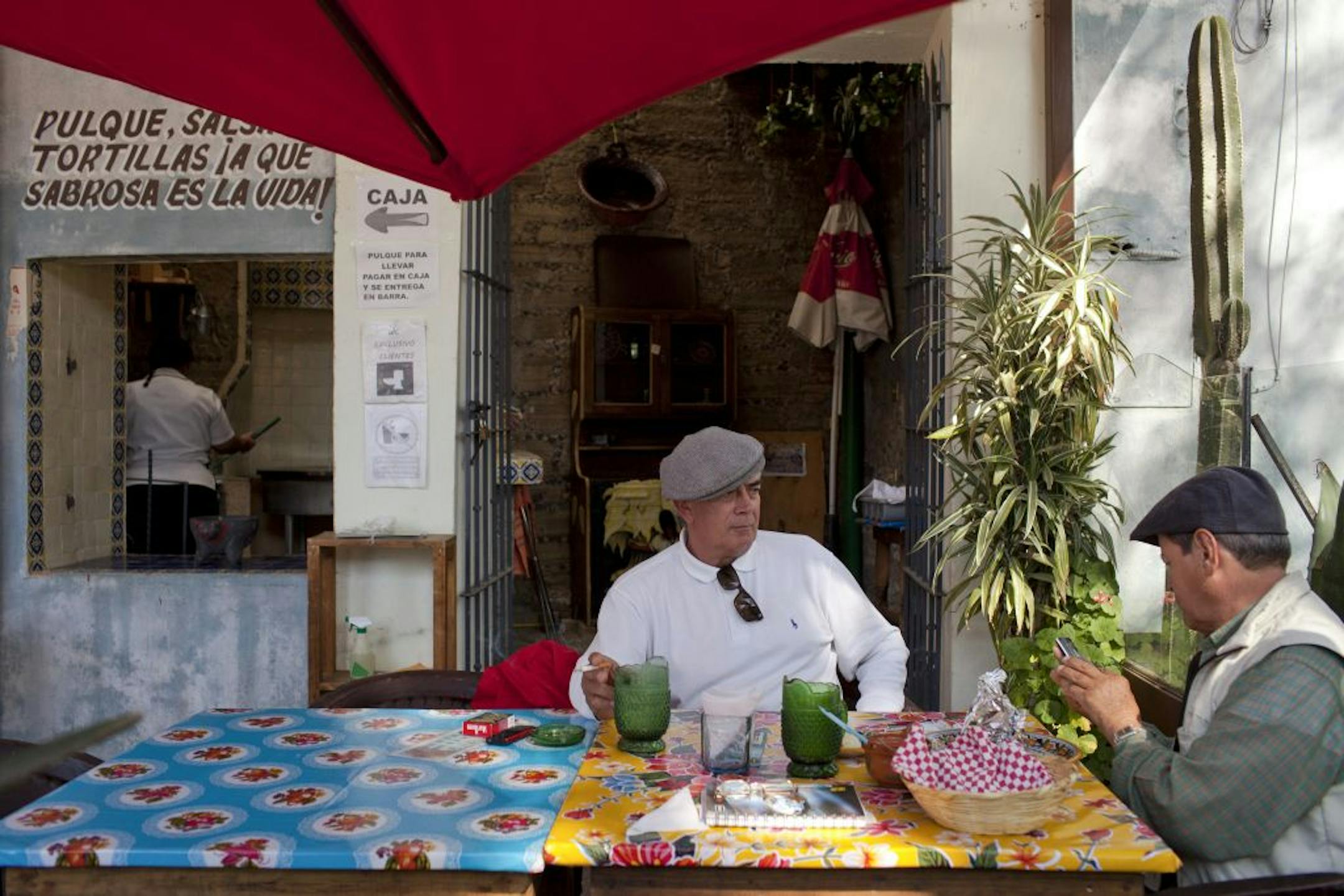 Bullfighters Miguel Villanueva, left, and Antonio Guzman relax at Pulqueria Tia Yola in Tlaxcala, Mexico.Pulque is a viscous, white, lightly alcoholic beverage, historically brewed on rural estates in the area.