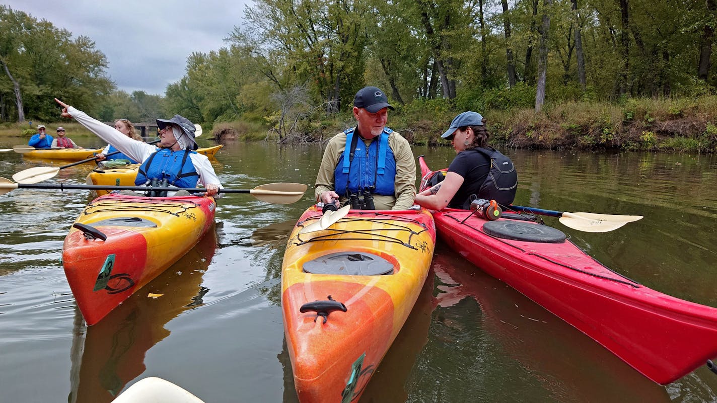 Broken Paddle Guiding Co., guide Isabel McNally, right, helps a client during a paddling trip on a tributary of the Mississippi River on Sept. 22 near Nelson, Wisconsin. McNally says it's "one of the great joys" of her job to be able to connect people to the Mississippi River. Credit: Mark Hoffman, Milwaukee Journal Sentinel