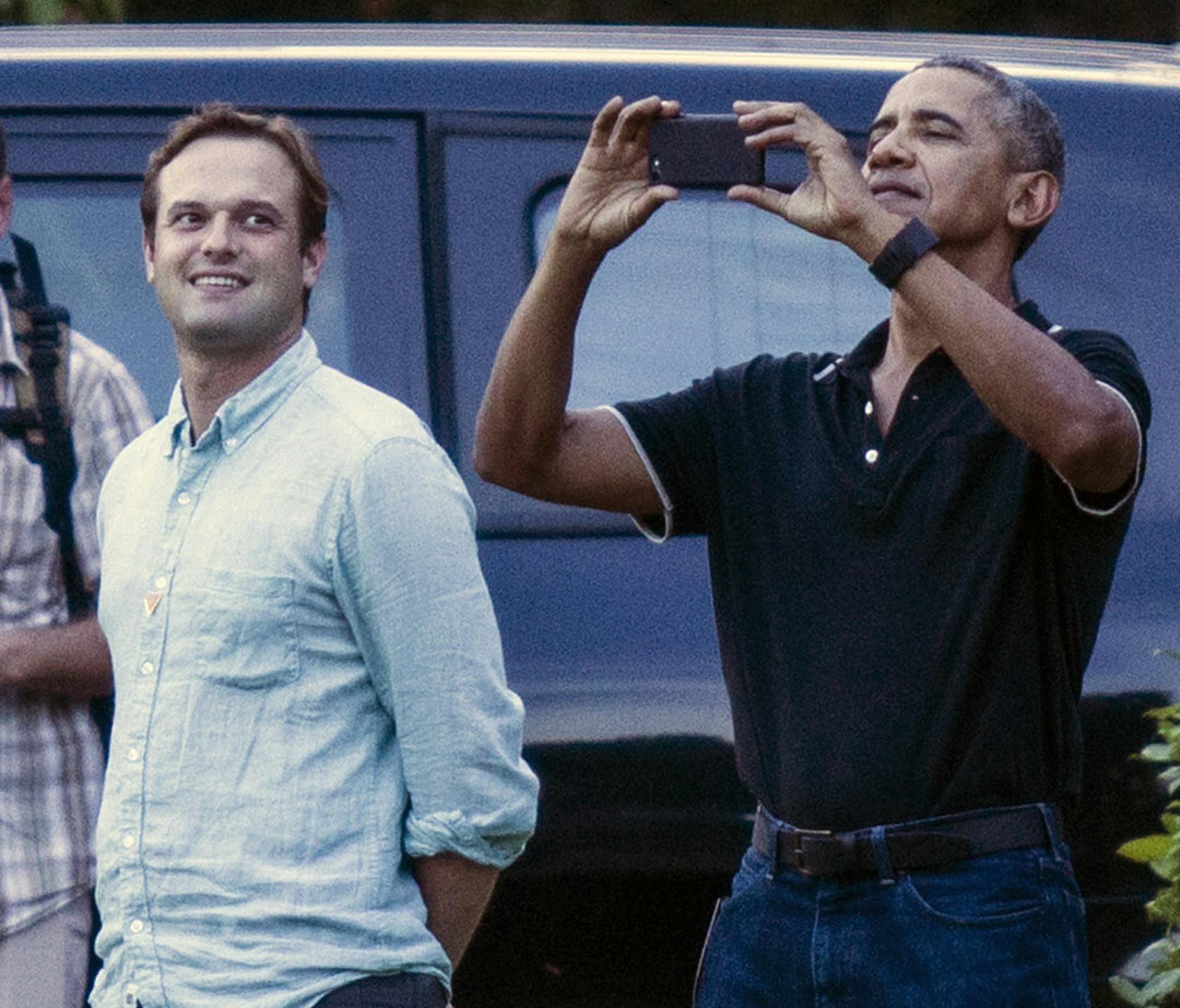 Former U.S. President Barack Obama, center, uses his mobile phone to take pictures during a tour at Borobudur Temple in Magelang, Central Java, Indonesia, Wednesday, June 28, 2017. Obama and his family wrapped up their five-day vacation on Indonesia's resort island of Bali and headed to the historic city of Yogyakarta on Wednesday during a nostalgic trip to the country where Obama lived for several years as a child. (AP Photo/Slamet Riyadi)