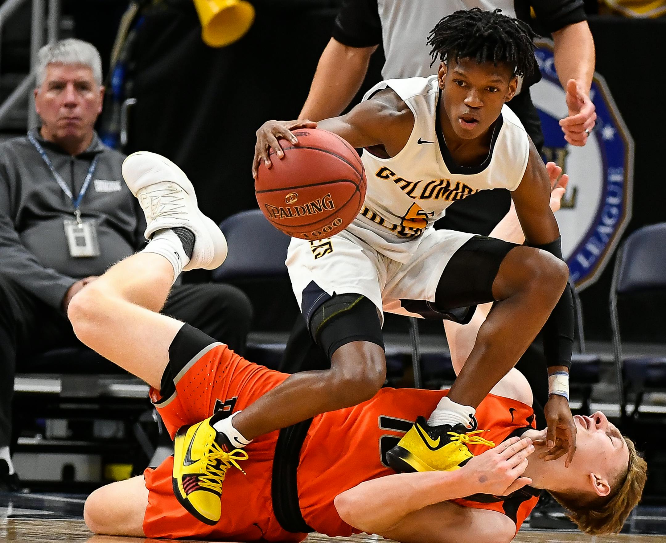 Columbia Heights guard Quentin Hardrict (5) and Delano guard Calvin Wishart (10) collided in the first half as Wishart turned the ball over. ] AARON LAVINSKY ï aaron.lavinsky@startribune.com Delano played Columbia Heights in the Class 3A boy's basketball championship game on Saturday, March 24, 2018 at Target Center in Minneapolis, Minn.