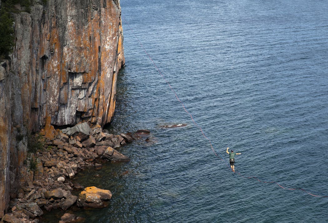 Mark McKee balanced above Lake Superior at Tettegouche State Park on the North Shore. “It’s very scary at first,” he said. “It’s very nerve-racking. Your palms are sweating.”