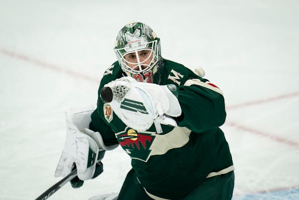 Minnesota Wild goalie Cam Talbot (33) blocked a puck before a scrimmage at the Xcel Energy Center in St. Paul, Minn., on Friday, January 8, 2021. ] RE