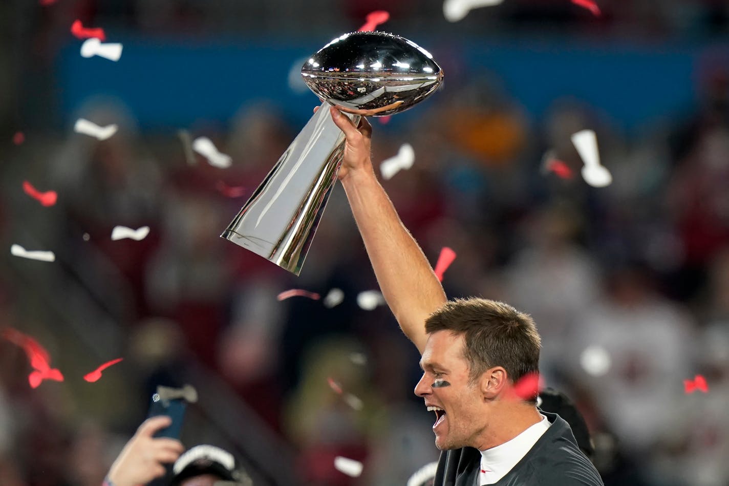 Tampa Bay Buccaneers quarterback Tom Brady celebrates with the Vince Lombardi Trophy after the NFL Super Bowl 55 football game against the Kansas City Chiefs Sunday, Feb. 7, 2021, in Tampa, Fla. The Buccaneers defeated the Chiefs 31-9 to win the Super Bowl. (AP Photo/Lynne Sladky)