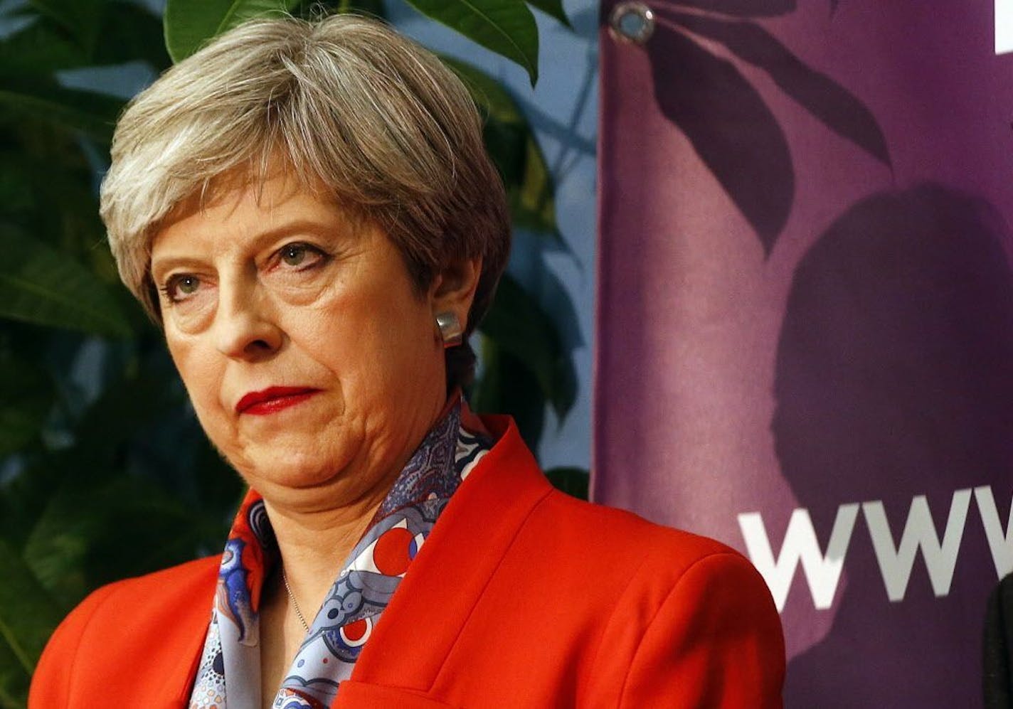 Britain's Prime Minister Theresa May listens as the declaration at her constituency is made for in the general election in Maidenhead, England, Friday, June 9, 2017. British Prime Minister Theresa May's gamble in calling an early election appeared Friday to have backfired spectacularly, after an exit poll suggested her Conservative Party could lose its majority in Parliament.