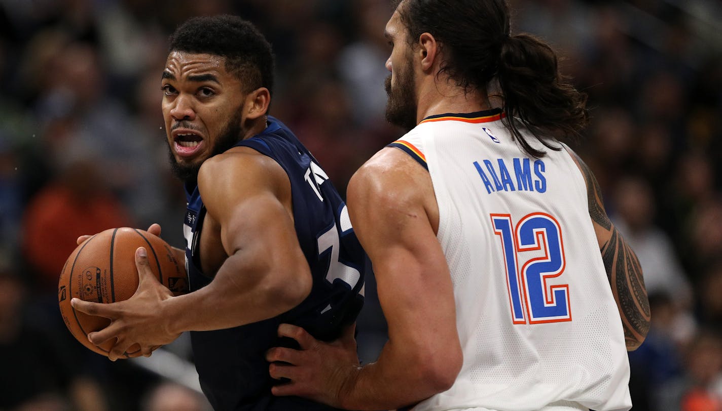 Timberwolves big man Karl-Anthony Towns, left, promises he will play tonight in Miami even though he's not feeling well.