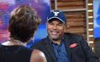 This image released by ABC shows co-host Robin Roberts, left, with "The Cosby Show" actor Geoffrey Owens during an interview on "Good Morning America,