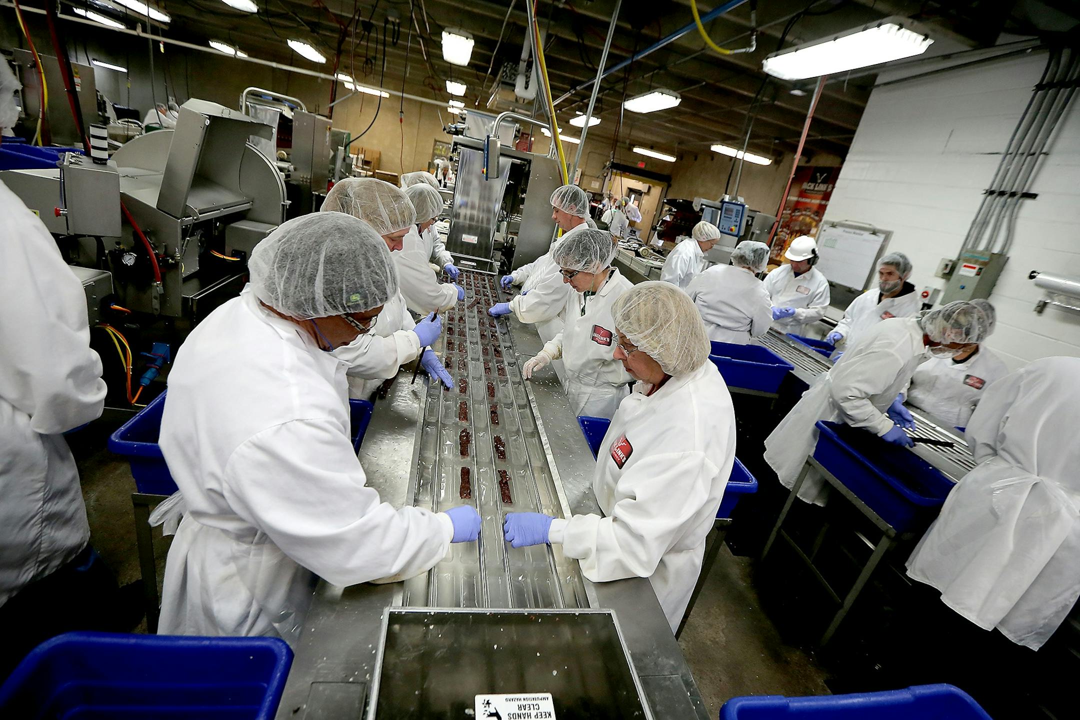 Workers processed Jack Links beef jerky in the packaging area, Monday, October 19, 2015 in Minong, Wis.