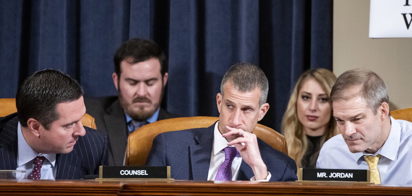 FILE -- From left, Rep. Devin Nunes (R-Calif.), the ranking member of the House Intelligence Committee, Steve Castor, the staff attorney for the Republicans, and Rep. Jim Jordan (R-Ohio) converse during an impeachment inquiry hearing in Washington, Nov. 20, 2019. Castor is a veteran government lawyer who now has a staring role in Washington's impeachment drama. (Samuel Corum/The New York Times)