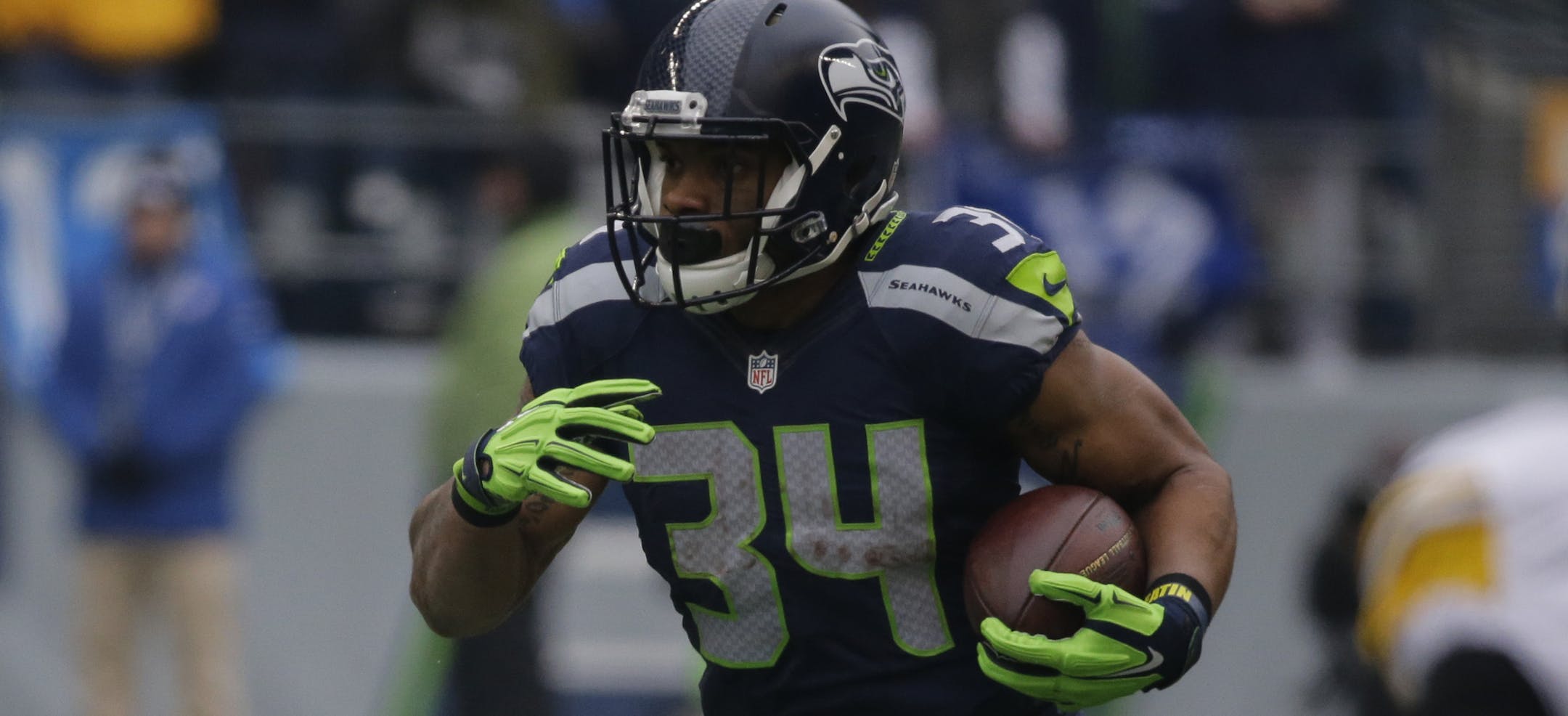 Seattle Seahawks' Thomas Rawls (34) rushes against the Pittsburgh Steelers in the first half of an NFL football game, Sunday, Nov. 29, 2015, in Seattle. (AP Photo/John Froschauer)