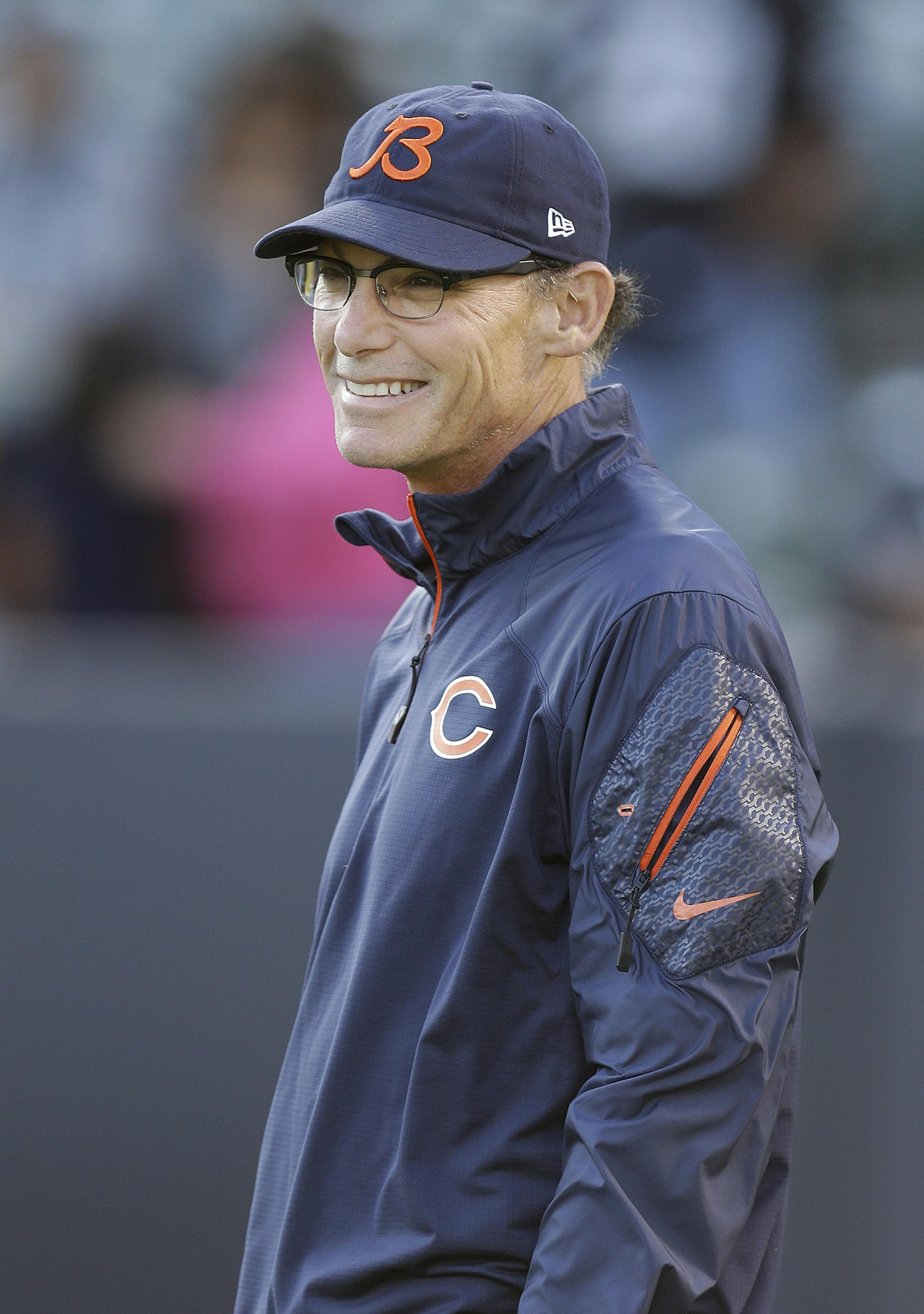 Chicago Bears head coach Marc Trestman smiles as players warm up before an NFL football game against the Oakland Raiders in Oakland, Calif., Friday, Aug. 23, 2013. (AP Photo/Ben Margot) ORG XMIT: MIN2013082821255526