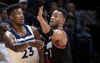 Jimmy Butler (23) passed the ball while being defended by Evan Turner (1) in the first quarter. ] CARLOS GONZALEZ &#xef; cgonzalez@startribune.com - D