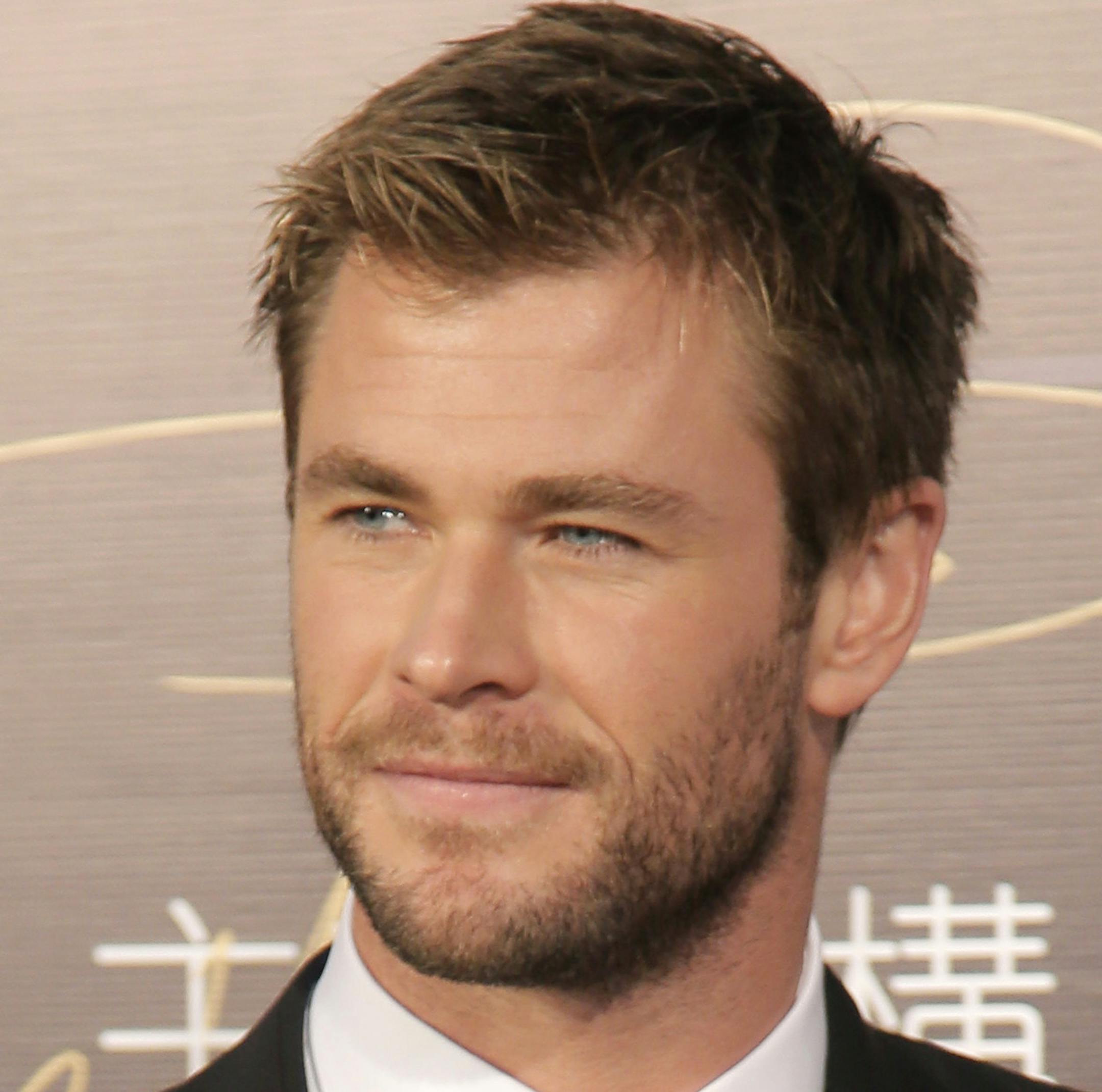 Australian actor Chris Hemsworth arrives for the 15th Huading Awards ceremony in Macau Sunday, Jan. 18, 2015. (AP Photo/Vincent Yu)