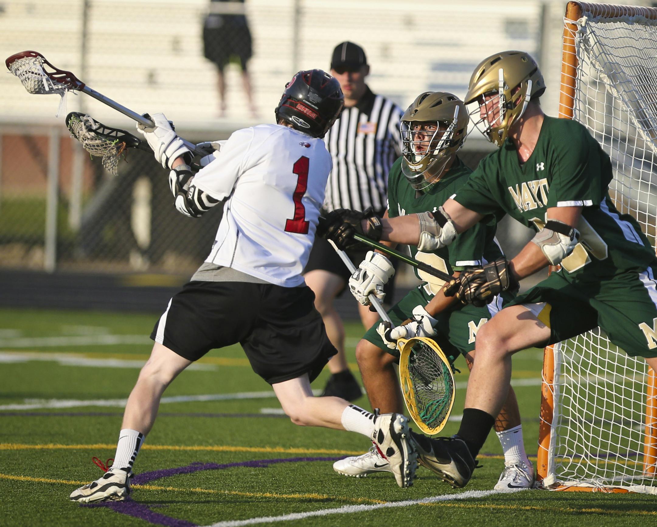 Eden Prairie’s Brooks Armitage wound up to score against Rochester Mayo goalie Troy Penz (18), who was being assisted by Zach Lorang (29). Armitage scored five goals on Tuesday as the Eagles advanced to a semifinal matchup against White Bear Lake.