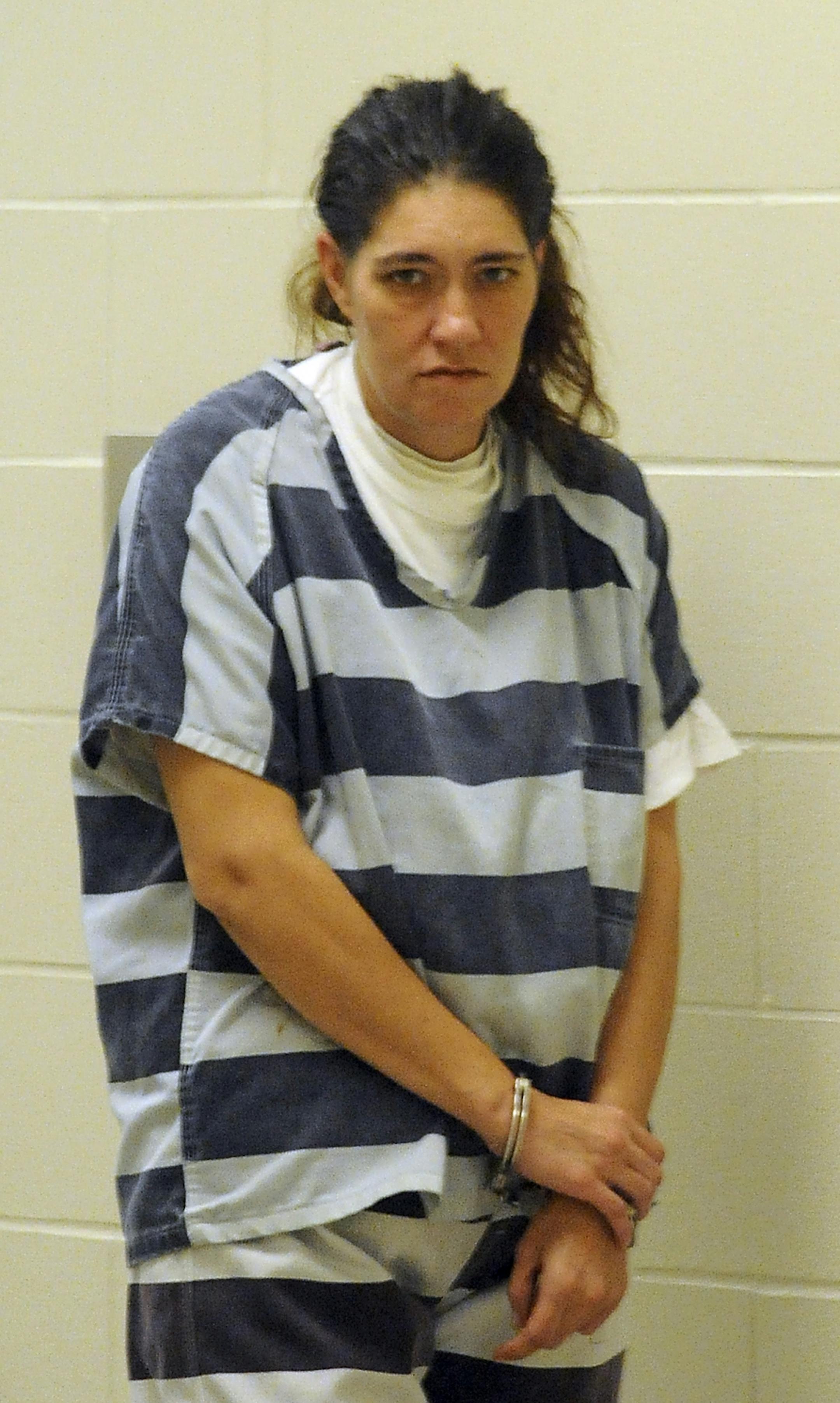 Angelina Mae Omara, 38 is escorted into court Friday in Sioux Falls, Nov 4, 2011. Omara, from Cold Spring, Minn., has been charged with second-degree murder in the death of her ex-husband after being arrested in Sioux Falls.