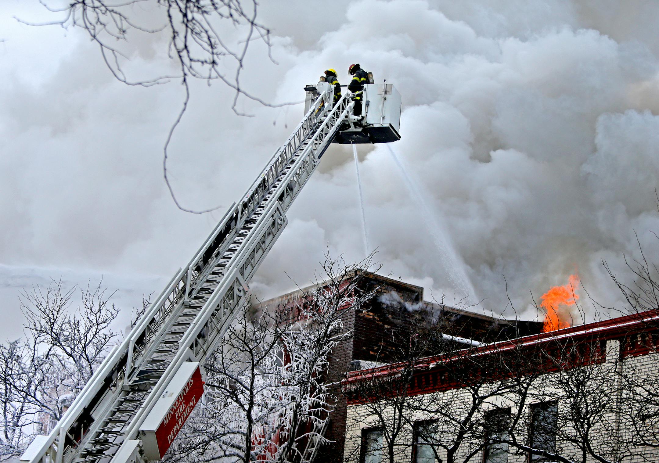 Minneapolis firefighters worked the scene of a fire on Cedar Avenue, Wednesday, January 1, 2012 (ELIZABETH FLORES/STAR TRIBUNE) ELIZABETH FLORES • eflores@startribune.com