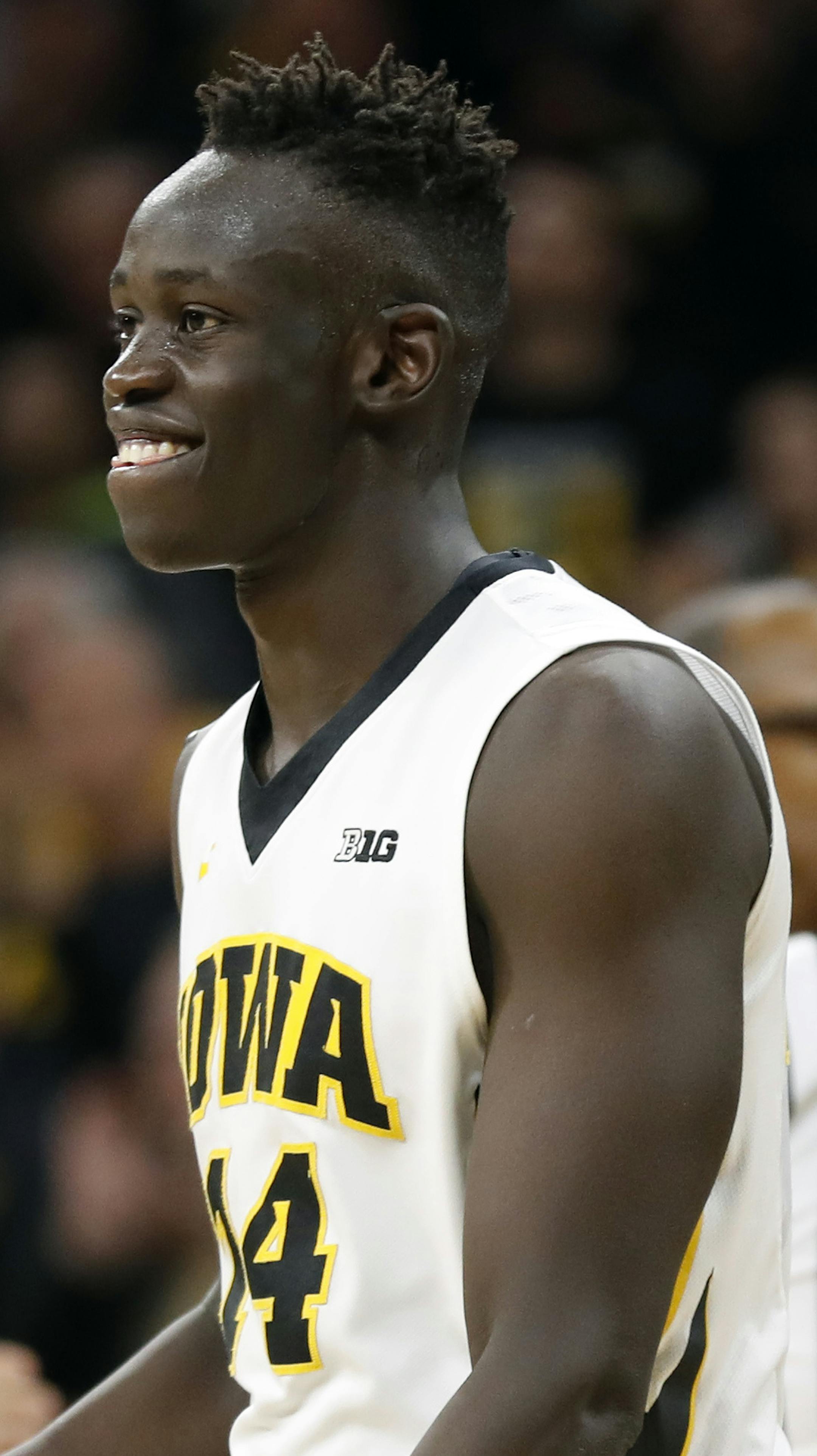 Iowa guard Peter Jok celebrates at the end of the team's NCAA college basketball game against Purdue, Thursday, Jan. 12, 2017, in Iowa City, Iowa. Jok scored 29 points as Iowa won 83-78. (AP Photo/Charlie Neibergall)