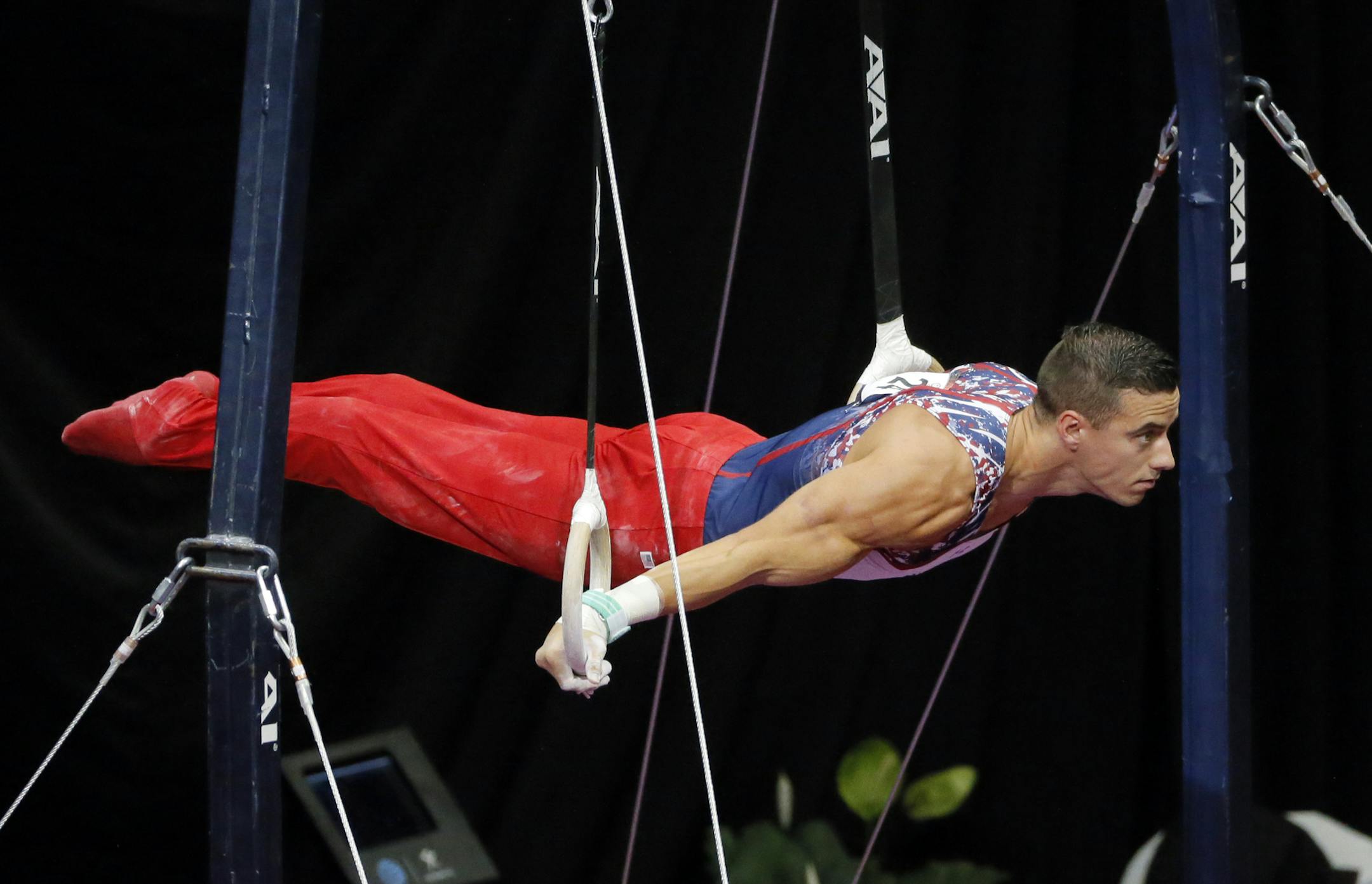 Jacob Dalton competes on the rings during the U.S men's Olympic gymnastics trials, Saturday, June 25, 2016, in St. Louis. (AP Photo/Tony Gutierrez)