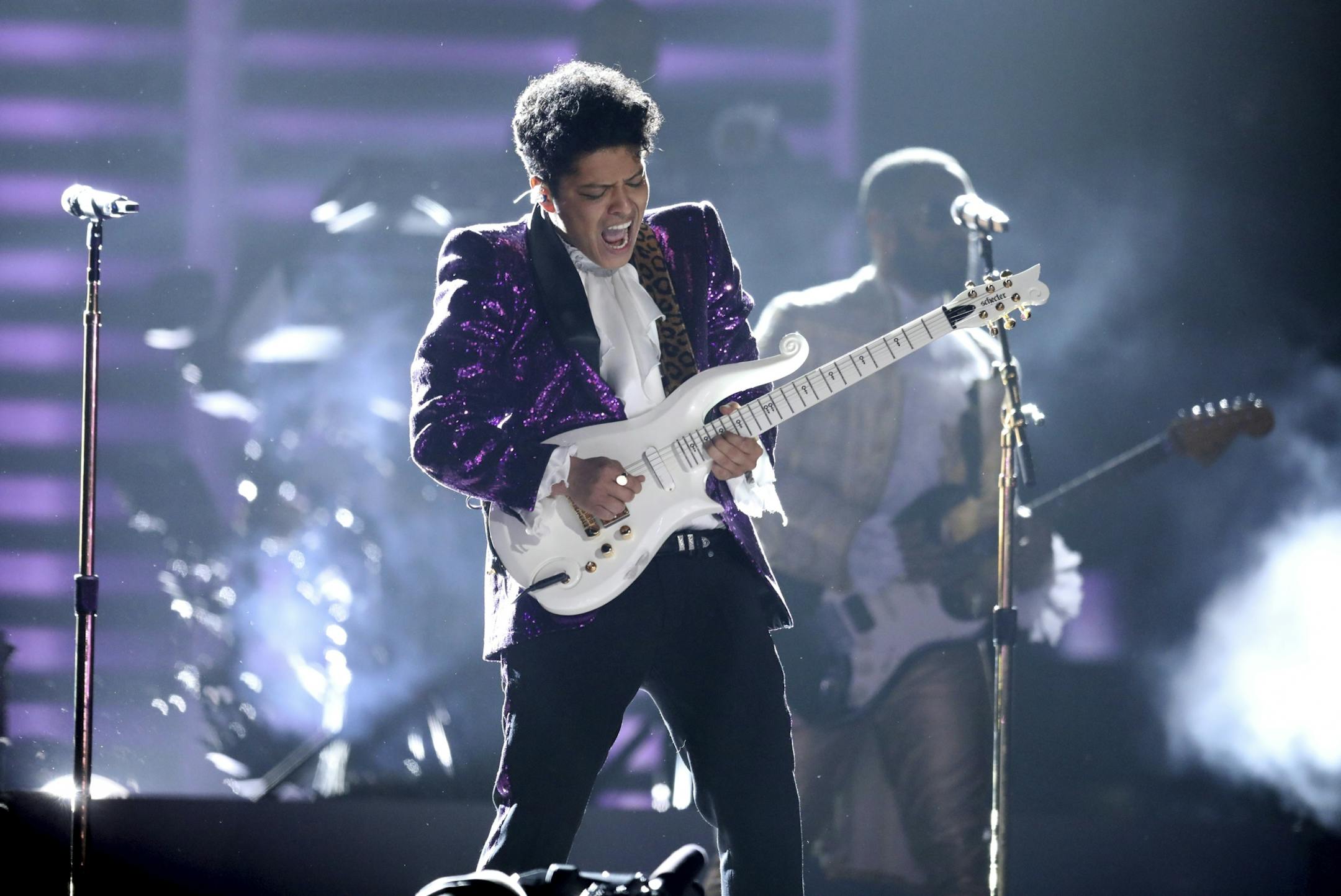 Bruno Mars performs "Let's Go Crazy" during a tribute to Prince at the 59th annual Grammy Awards.