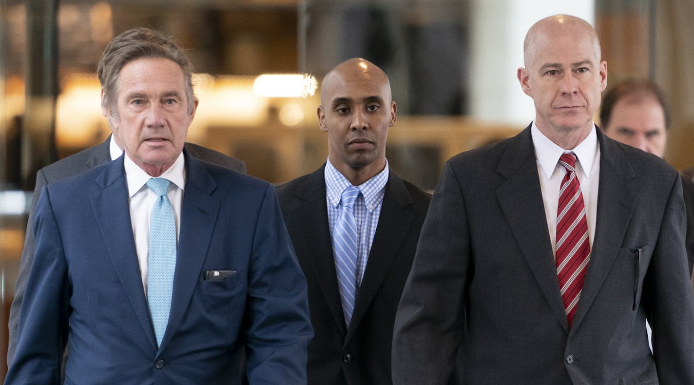 Former Minneapolis police officer Mohamed Noor, center, walked into the Hennepin County Courthouse for the verdict in the shooting death of Justine Ruszczyk Damond with his lawyers Peter Wold (left) and Thomas Plunkett (right) in Minneapolis, Minn., on Tuesday, April 30, 2019. ] RENEE JONES SCHNEIDER &#xa5; renee.jones@startribune.com