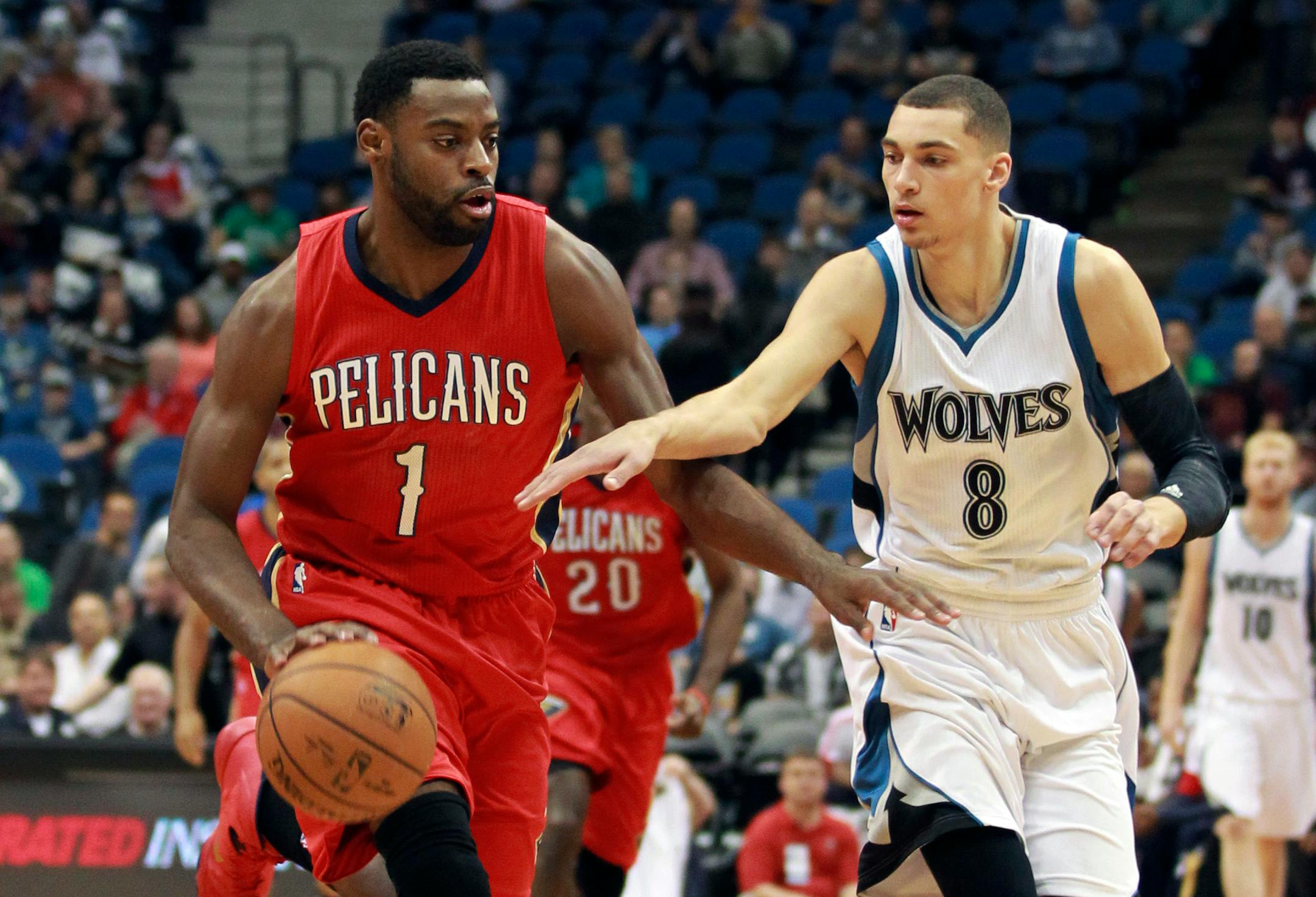 New Orleans Pelicans Tyreke Evans (1) dribbles the ball against Minnesota Timberwolves Zach LaVine (8) in the half of an NBA basketball game Monday, April 13, 2015, in Minneapolis. (AP Photo/Andy Clayton-King)