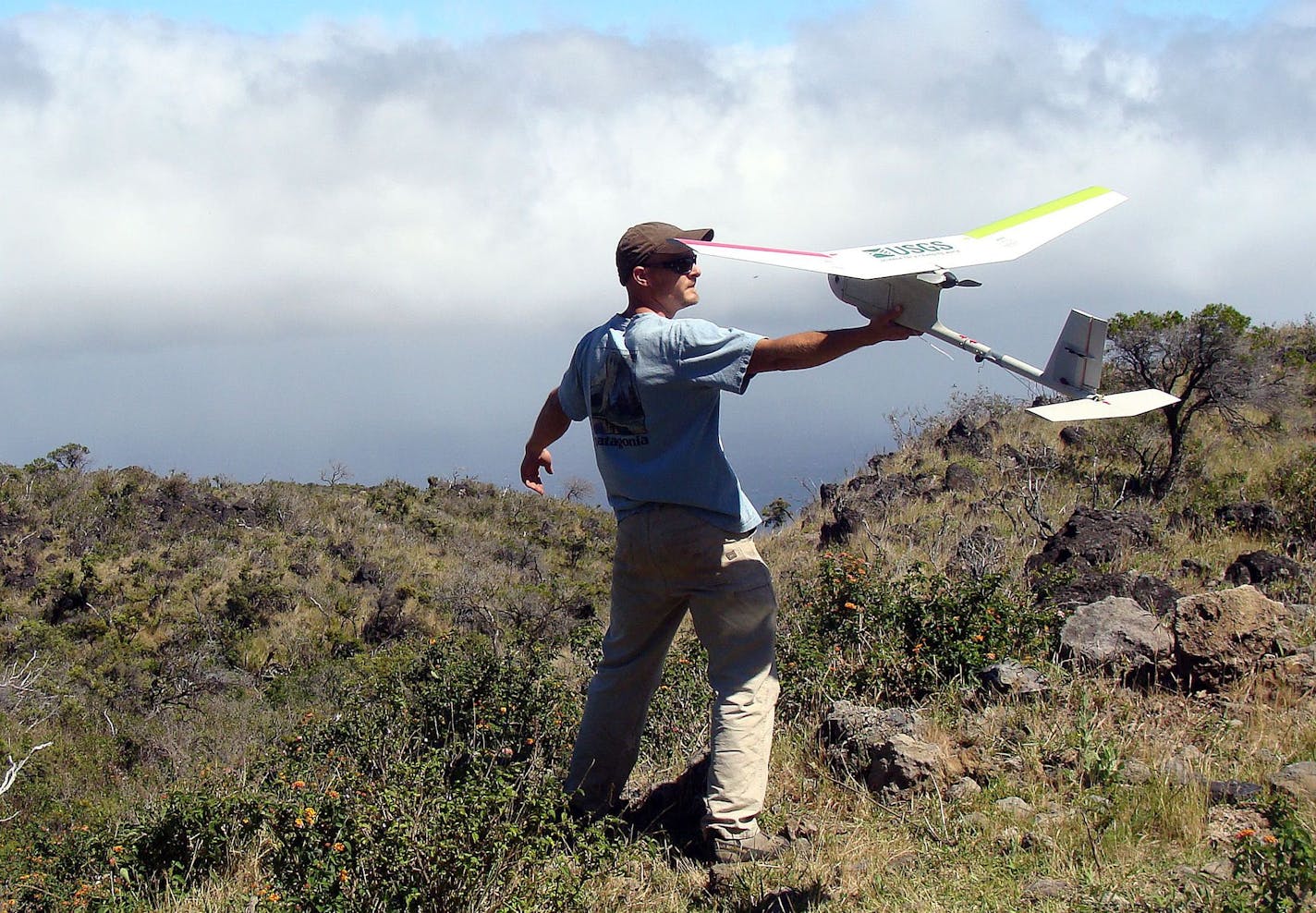 This photo provided by The U.S. Geological Survey,Todd Preston, Parallel Inc, launches a drone during a US Geological Survey project at Haleakala National Park, Maui, Hawaii in May 2012. The U.S. Geological Survey started using unmanned aircraft for wildlife and land management work about two years ago. Its first Nevada mission, planned for August or September, involves counting sheep and deer within the Desert National Wildlife Refuge north of Las Vegas(AP Photo/Las Vegas Review-Journal, USGS)