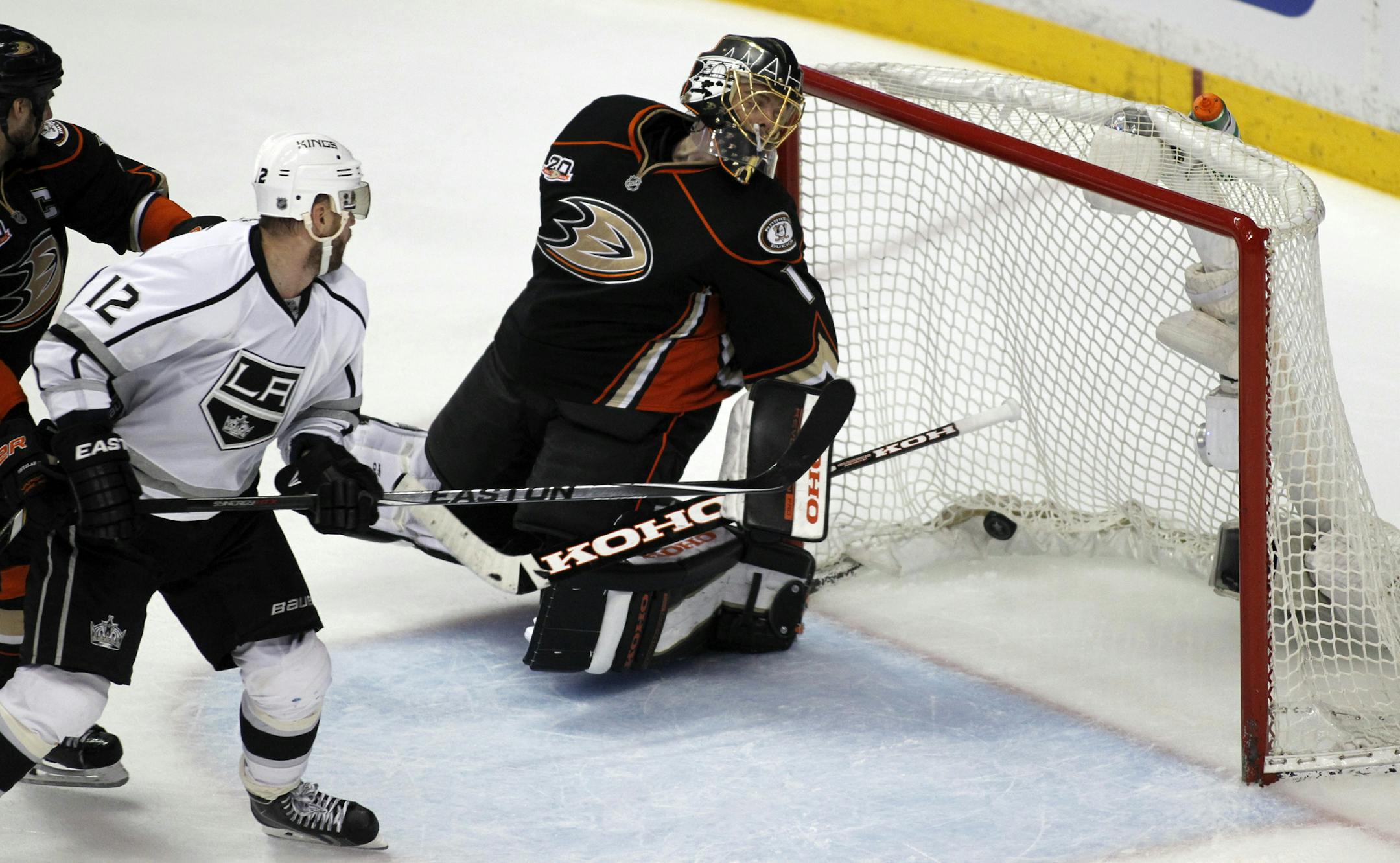 Los Angeles Kings right wing Marian Gaborik (12), of the Czech Republic, scores on Anaheim Ducks goalie Jonas Hiller (1), of Switzerland, during the overtime period to win 3-2 in Game 1 of an NHL hockey second-round Stanley Cup playoff series in Anaheim, Calif., Saturday, May 3, 2014. (AP Photo/Alex Gallardo)