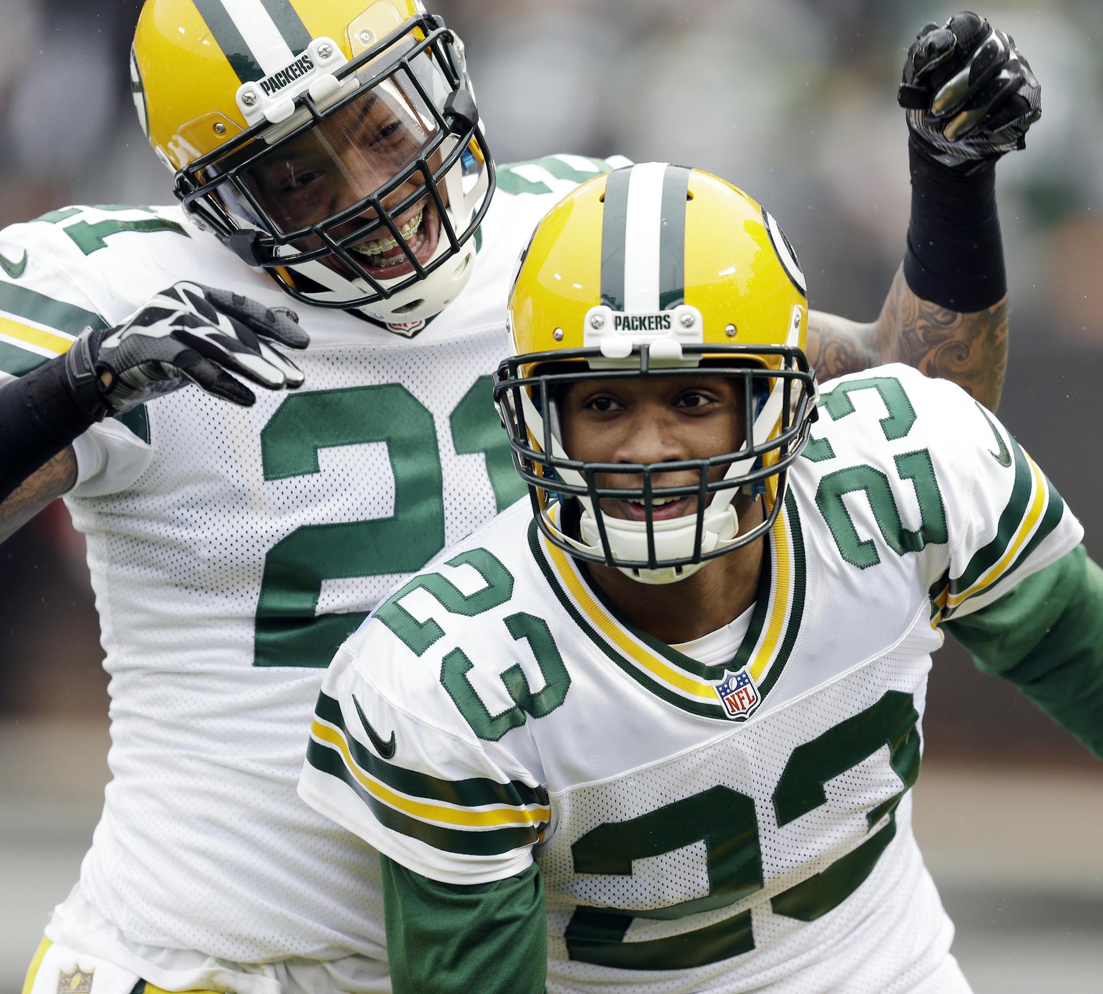 Green Bay Packers cornerback Damarious Randall (23) celebrates with teammate Ha Ha Clinton-Dix after Randall returned an interception for a touchdown against the Oakland Raiders during the first half of an NFL football game Sunday, Dec. 20, 2015, in Oakland, Calif. (AP Photo/Ben Margot)