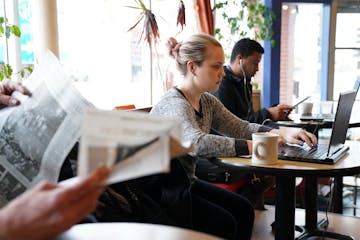 Melanie Galloway, an adjunct professor of physics at Hamline University, prepped for her course Thursday at Gingko Coffeehouse near campus.