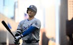 Los Angeles Dodgers designated hitter Shohei Ohtani (17) reacts after striking out against the Minnesota Twins in the top of the first inning Tuesday,