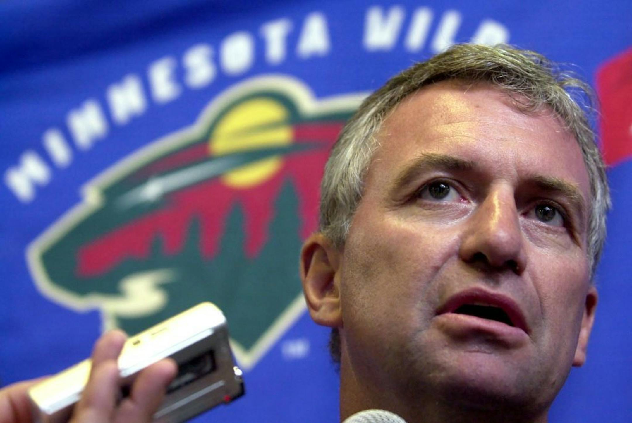 Minnesota Wild general manager and team president Doug Risebrough talks with reporters after the first day of the Wild's training camp in Inver Grove Heights, Minn., Friday, Sept. 12, 2003. Risebrough cautioned that he and the coaching staff will measure the team by how much it improves over the year, not necessarily by wins or losses.