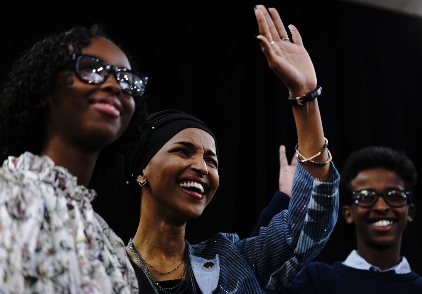 Ilhan Omar, flanked by family, delivers her victory speech.