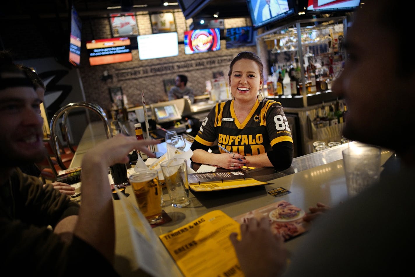 Bartender Lynea Vance has worked for Buffalo Wild Wings for two years and enjoys interacting with customers. The Southdale location of Buffalo Wild Wings has its regulars.