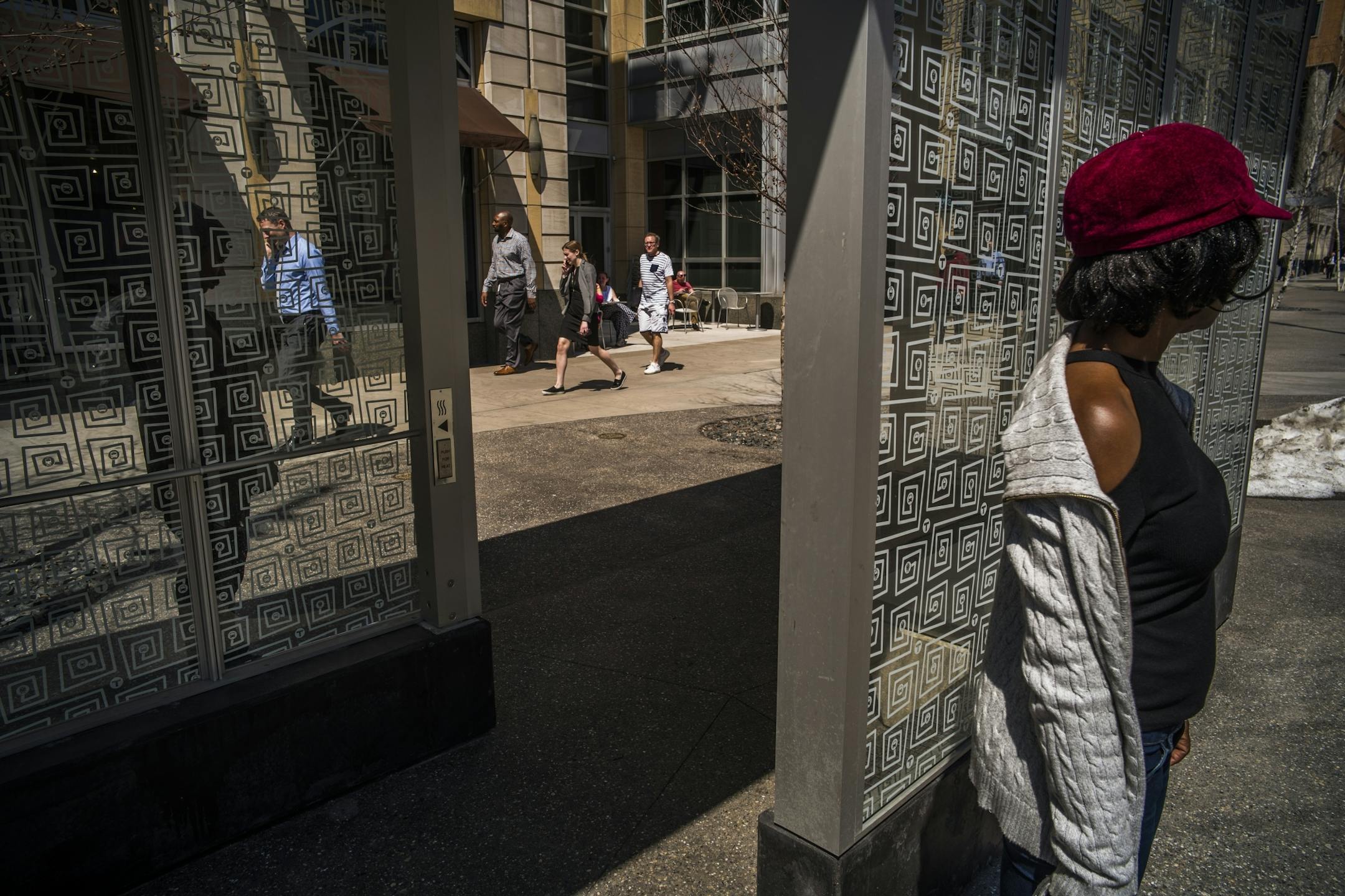 Clo Glou who is from Togo waited for her bus on Nicollet Mall. She was more than happy that spring is here.