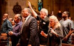 Attendees of Friday night's "The Dream Continues" service sang along with the song, "How Great is Our God," performed by the Minnesota State Baptist C