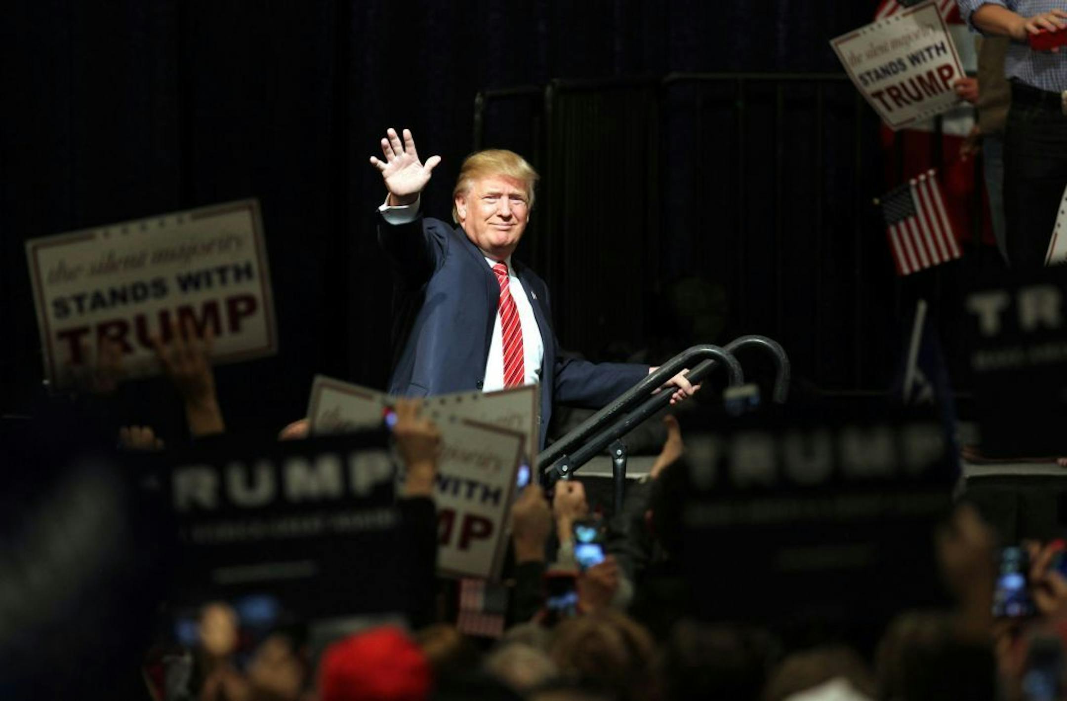 Republican presidential candidate Donald Trump walks onstage for a rally at the Reno Ballroom and Museum in Reno, Nevada, Sunday, Jan. 10, 2016.