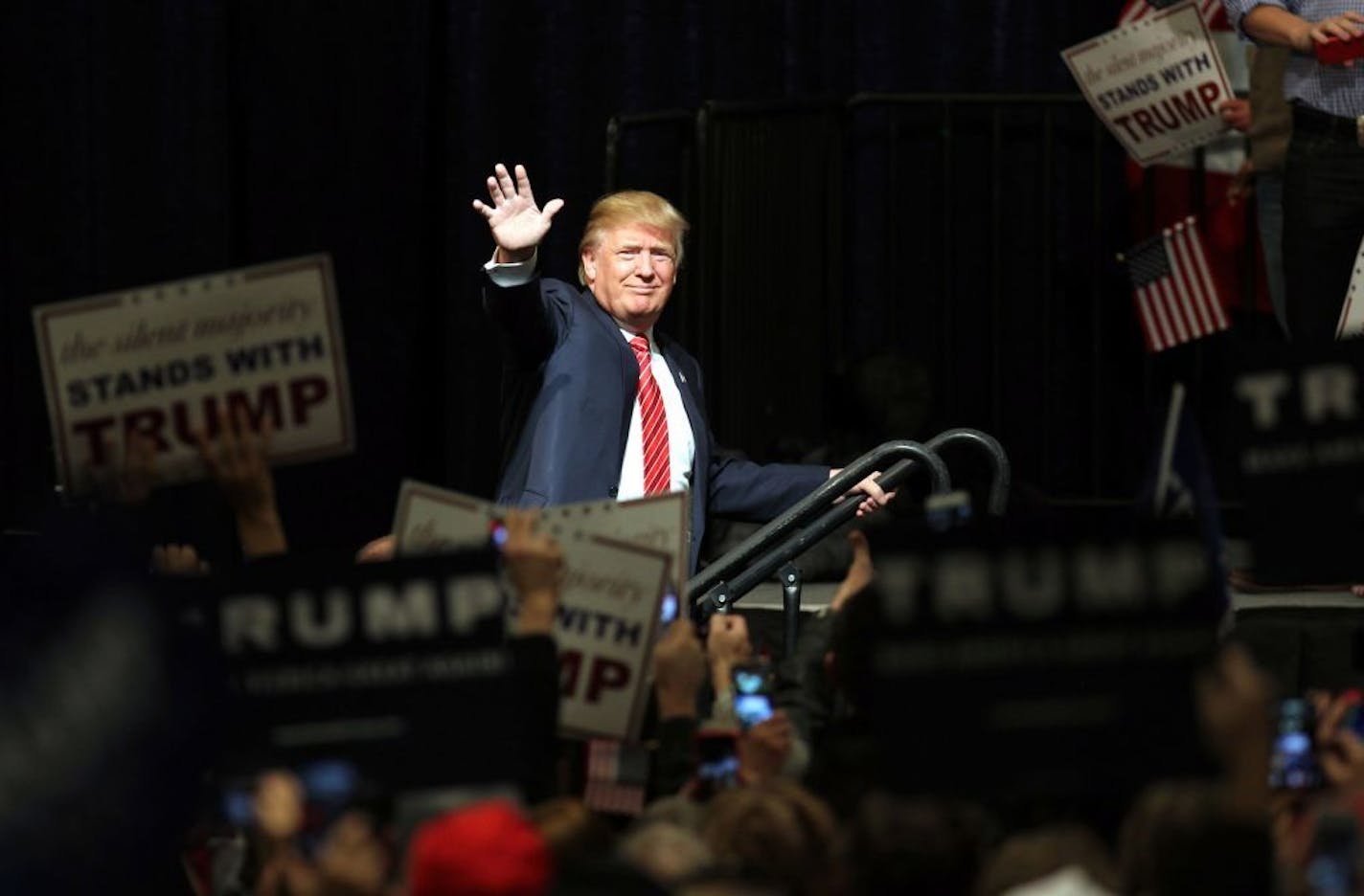 Republican presidential candidate Donald Trump walks onstage for a rally at the Reno Ballroom and Museum in Reno, Nevada, Sunday, Jan. 10, 2016.