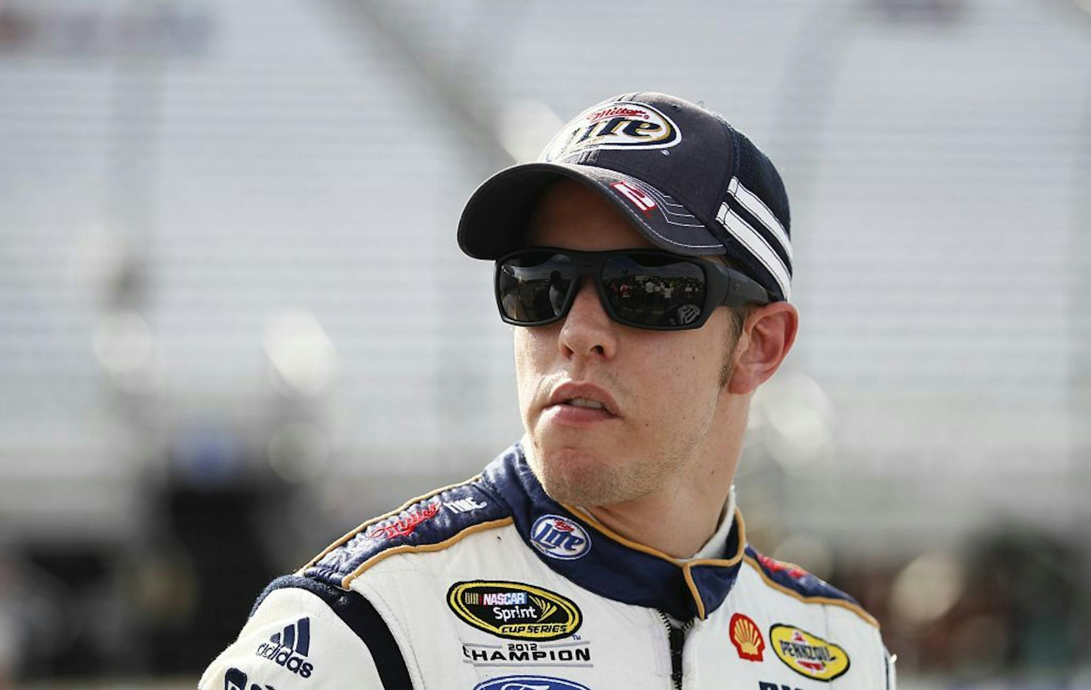 Brad Keselowski watches cars during qualifying for the NASCAR Sprint Cup auto race at New Hampshire Motor Speedway in Loudon, N.H., Friday, July 12, 2013. Keselowski won the pole.