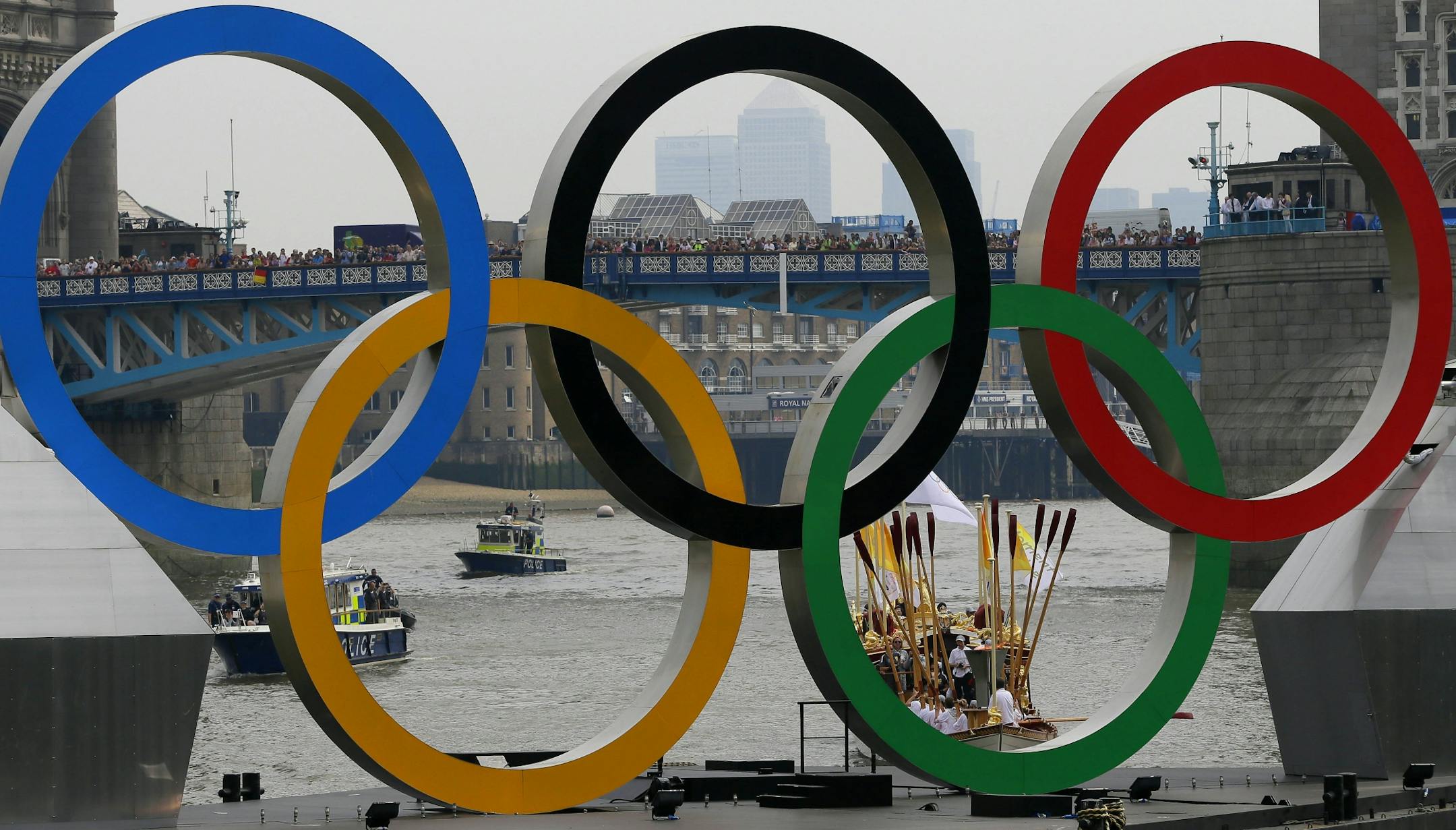 The royal barge Gloriana carries the Olympic flame along the river Thames, ahead of the 2012 Summer Olympics, on the final day of the Torch Relay, Friday, July 27, 2012, in London. The opening ceremonies for the 2012 London Olympics will be held Friday evening.