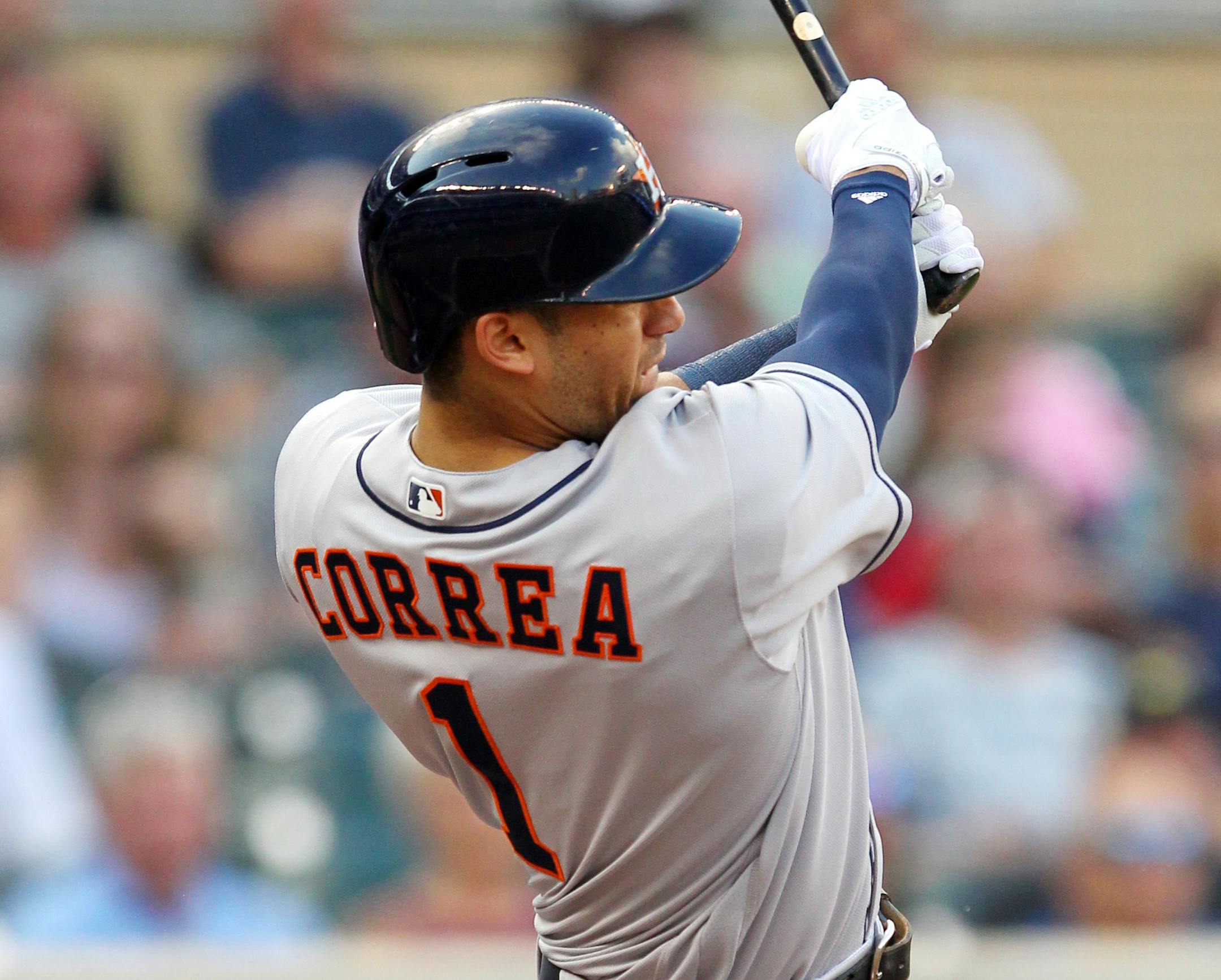The Astros' Carlos Correa followed through on a two-run home run against the Twins during the first inning Tuesday at Target Field. Houston won 7-5.