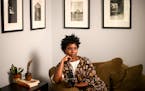 Photographer Jovan Speller sat for a portrait in her Northeast Minneapolis apartment on Wednesday, August 30, 2017.