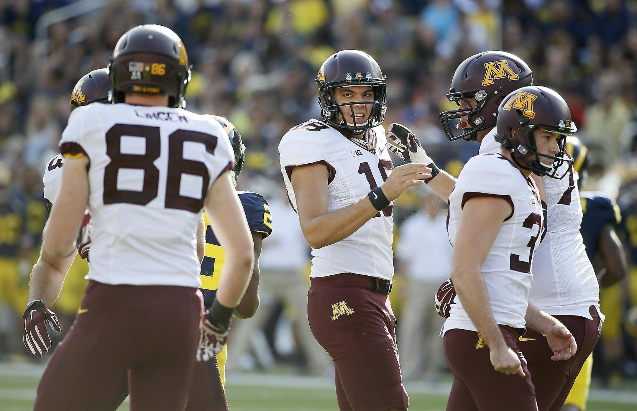 Minnesota place kicker Ryan Santoso (18) celebrated a field goal during the third quarter at Michigan Stadium, Saturday, September 27, 2014 in Ann Arbor, MI.