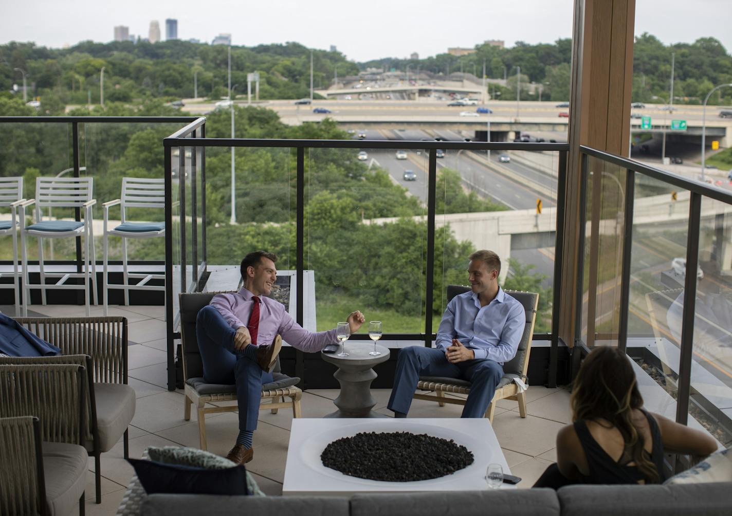 Daniel Colvin, left, and Randy Brown visited with Caitlin Dicks on the rooftop deck of the Talo Apartments in Golden Valley Thursday evening. Colvin and Brown both live there; Dicks is moving into the building Friday. ] JEFF WHEELER &#xef; jeff.wheeler@startribune.com An apartment building boom just as big in Minneapolis is quietly happening in the suburbs of Golden Valley, Eagan, and Apple Valley. The Talo Apartments overlooking I-394 in Golden Valley is attracting young professionals like Rand