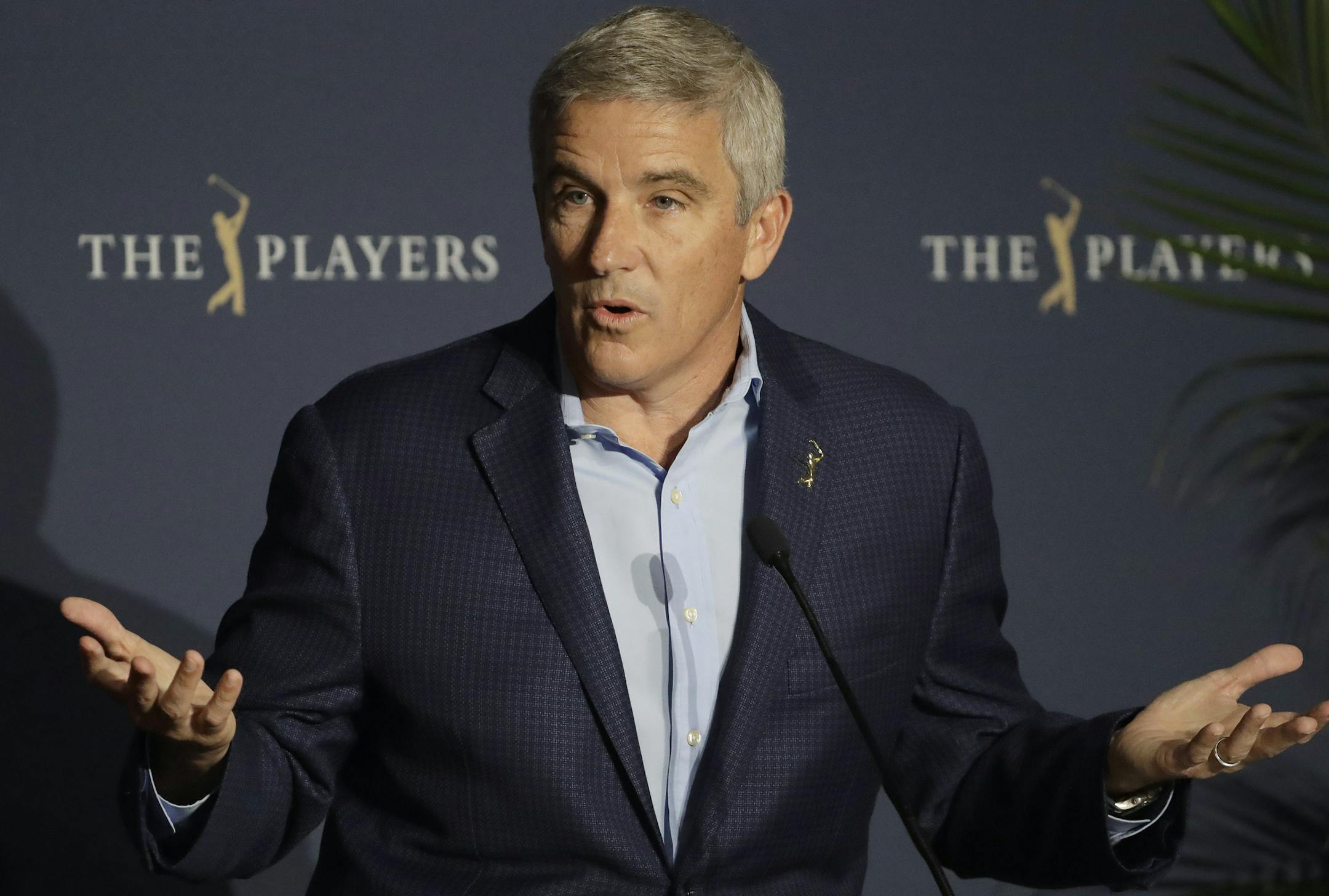 FILE - In this March 13, 2020, file photo, PGA Tour Commissioner Jay Monahan reacts to a question during a news conference at The Players Championship golf tournament, in Ponte Vedra Beach, Fla. It's been over three months since the commissioners of major sports cancelled or postponed events because of the coronavirus. Enough time for us to grade them on how they've handled the virus so far. (AP Photo/Chris O'Meara, File)