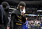 Jamal Murray leave the floor after Game 2 of the playoffs between the Timberwolves and Nuggets.