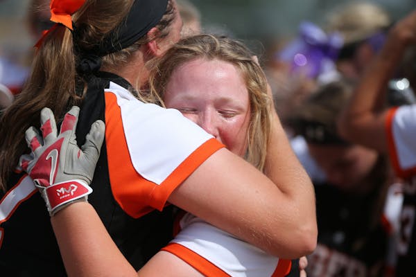 Farmington infielder Olivia Hazelbaker celebrated with Emma Frost after the Tigers beat Anoka 1-0 for the 2017 Class 4A softball title.
