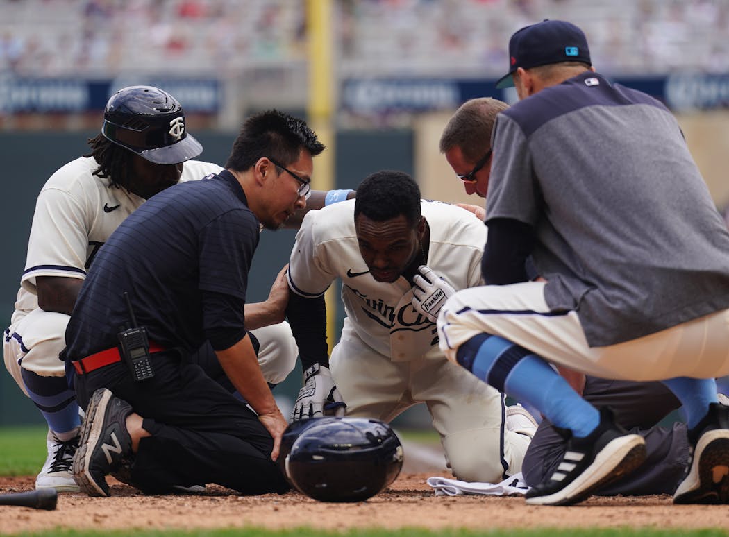 Michael A. Taylor was hit in the back of the head by a pitch in the eighth inning.