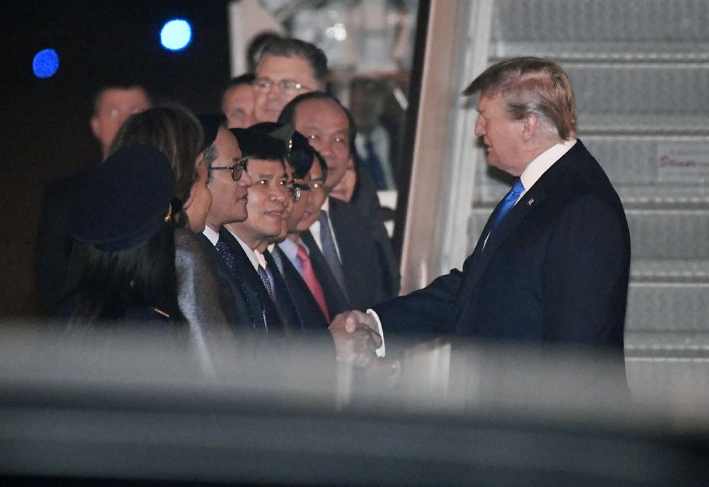 President Donald Trump is greeted after arriving on Air Force One at Noi Bai International Airport, in Hanoi, Vietnam, Tuesday, Feb. 26, 2019, ahead of his second summit with North Korea's Kim Jong Un, scheduled for Wednesday.